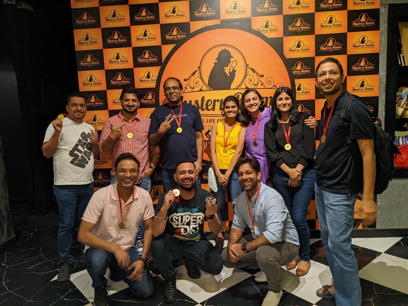 The team wearing medals after an escape-room challenge