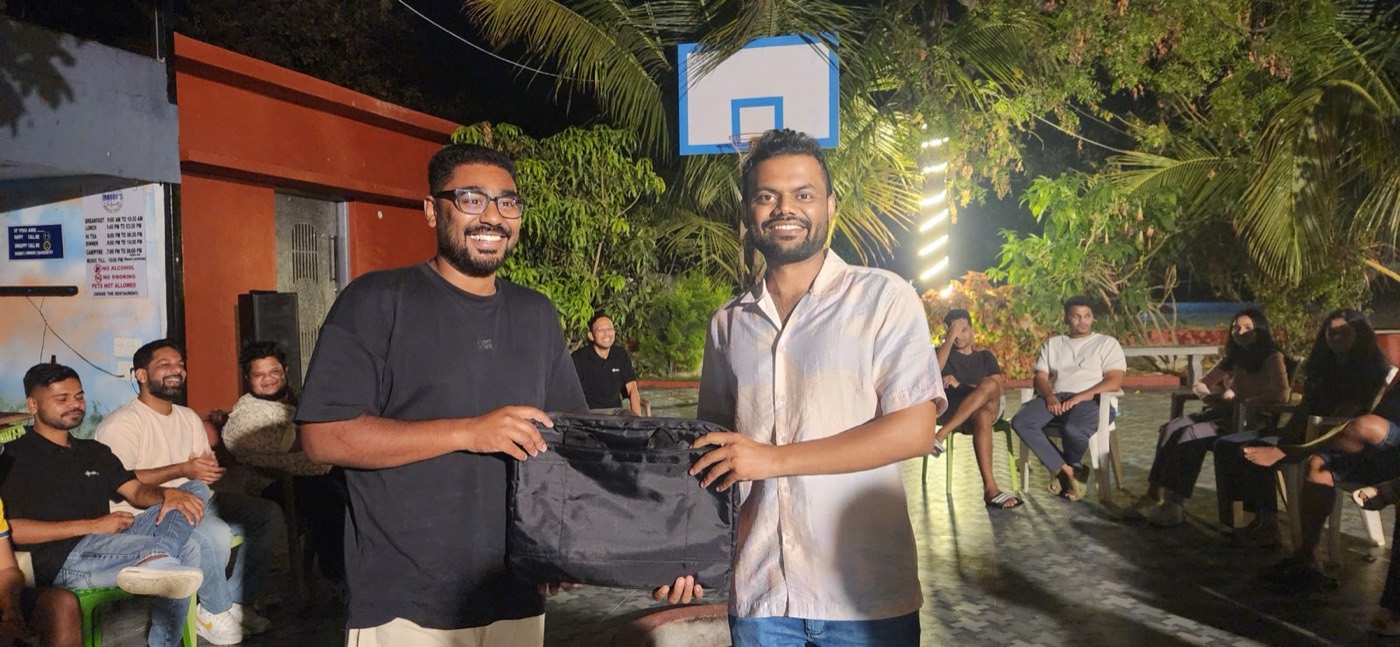 An award handover on rewards-and-recognition night at the offsite